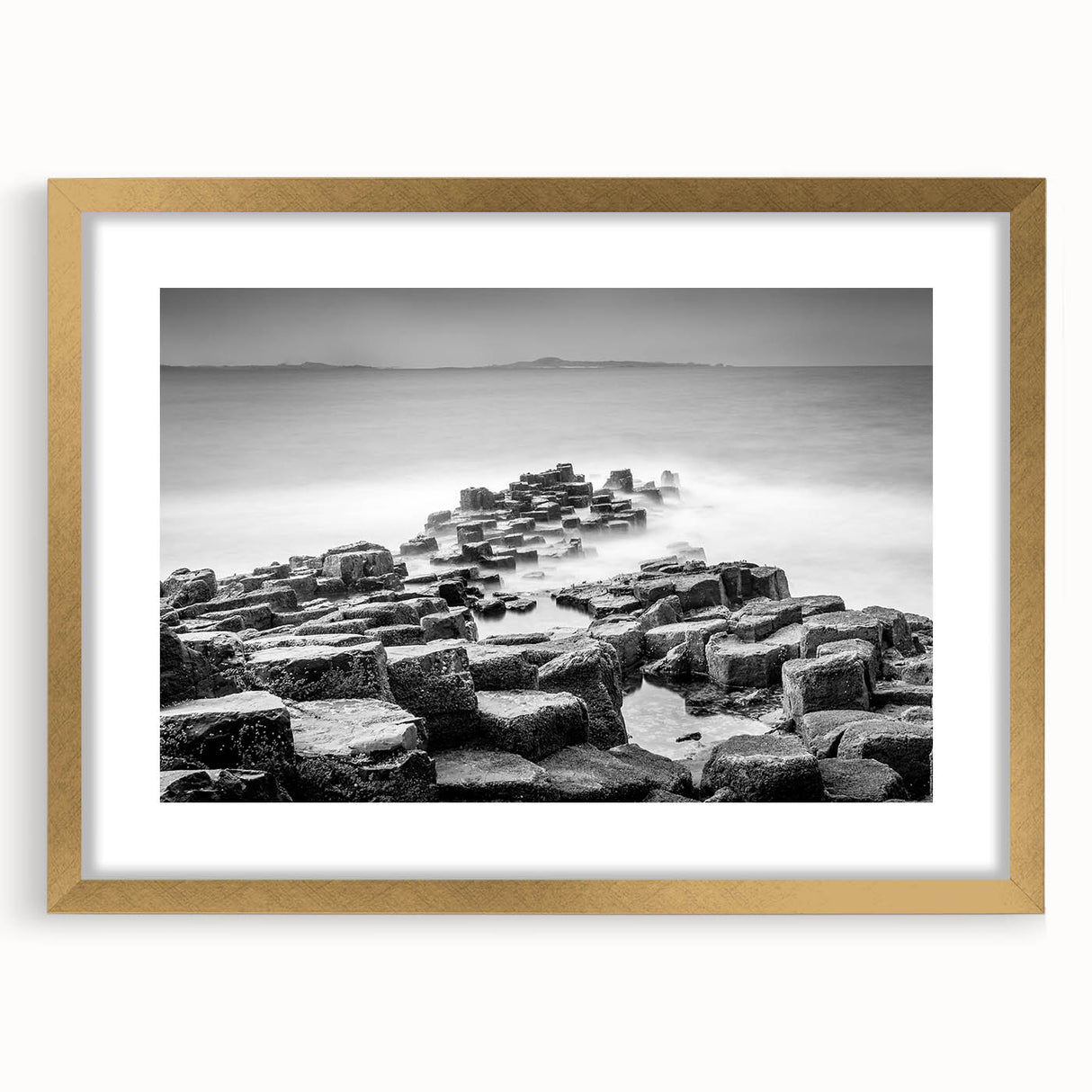 Abstract art print of a Northern Ireland scenery in muted green and blue tones, framed in gold, ideal for dining room decor.