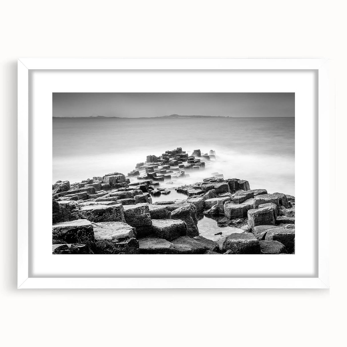 Textured abstract art print depicting a Northern Ireland scenery in muted earth tones on a white-framed canvas.