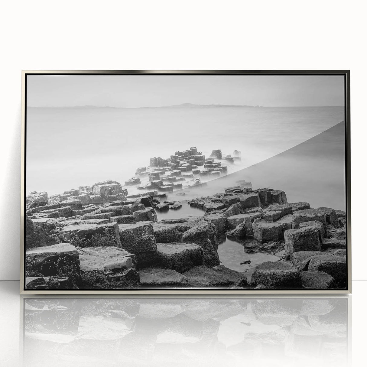 Acrylic print of a Northern Ireland landscape in muted greens and blues, framed in silver.