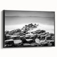 Black and white wall art featuring a vintage poster style landscape of Northern Ireland on a framed canvas.