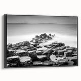 Black and white wall art featuring a vintage poster style landscape of Northern Ireland on a framed canvas.