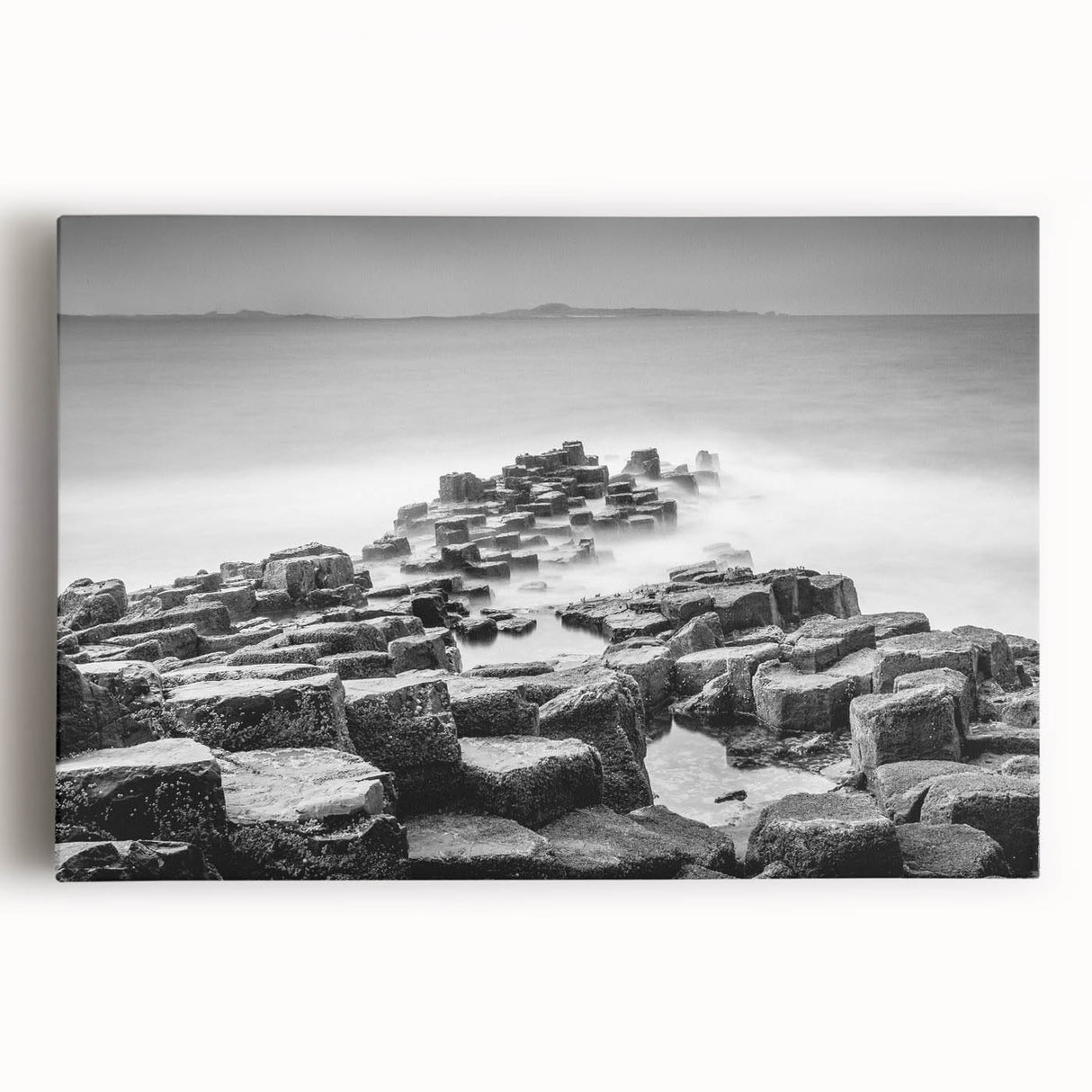 Black and white photo of Northern Ireland's rugged coastline on stretched canvas, ideal for kitchen wall art.