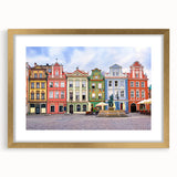 Abstract art print of a European scenery in muted earth tones, framed in gold, suitable for bedroom or dining room decor.