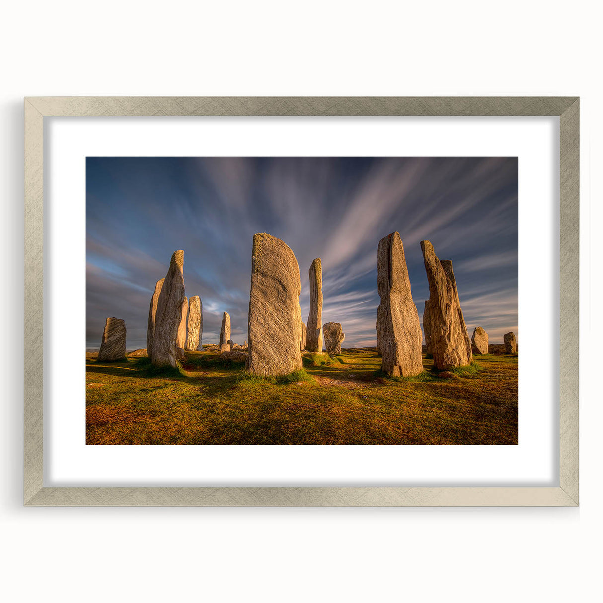 Extra large abstract art print of a Scottish landscape in muted greens and blues, framed in silver.