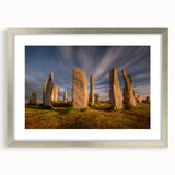 Extra large abstract art print of a Scottish landscape in muted greens and blues, framed in silver.