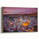 Framed canvas depicting a vintage landscape painting of Guanajuato, Mexico in muted gold and black tones.
