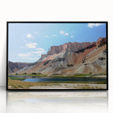 Large abstract wall art depicting a Middle Eastern desert scene in muted earth tones on a framed acrylic print.