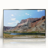 Mid-century modernist art depicting a serene Middle Eastern landscape in muted earth tones, framed in silver acrylic.