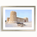 Abstract textured art print of a Middle Eastern scenery in muted earth tones, framed in silver, suitable for bedroom decor.