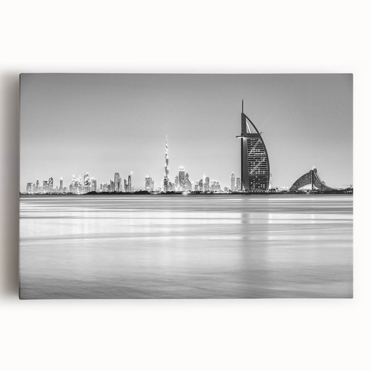 Black and white stretched canvas of Burj Al Arab, ideal for kitchen art with its large format and minimalist design.