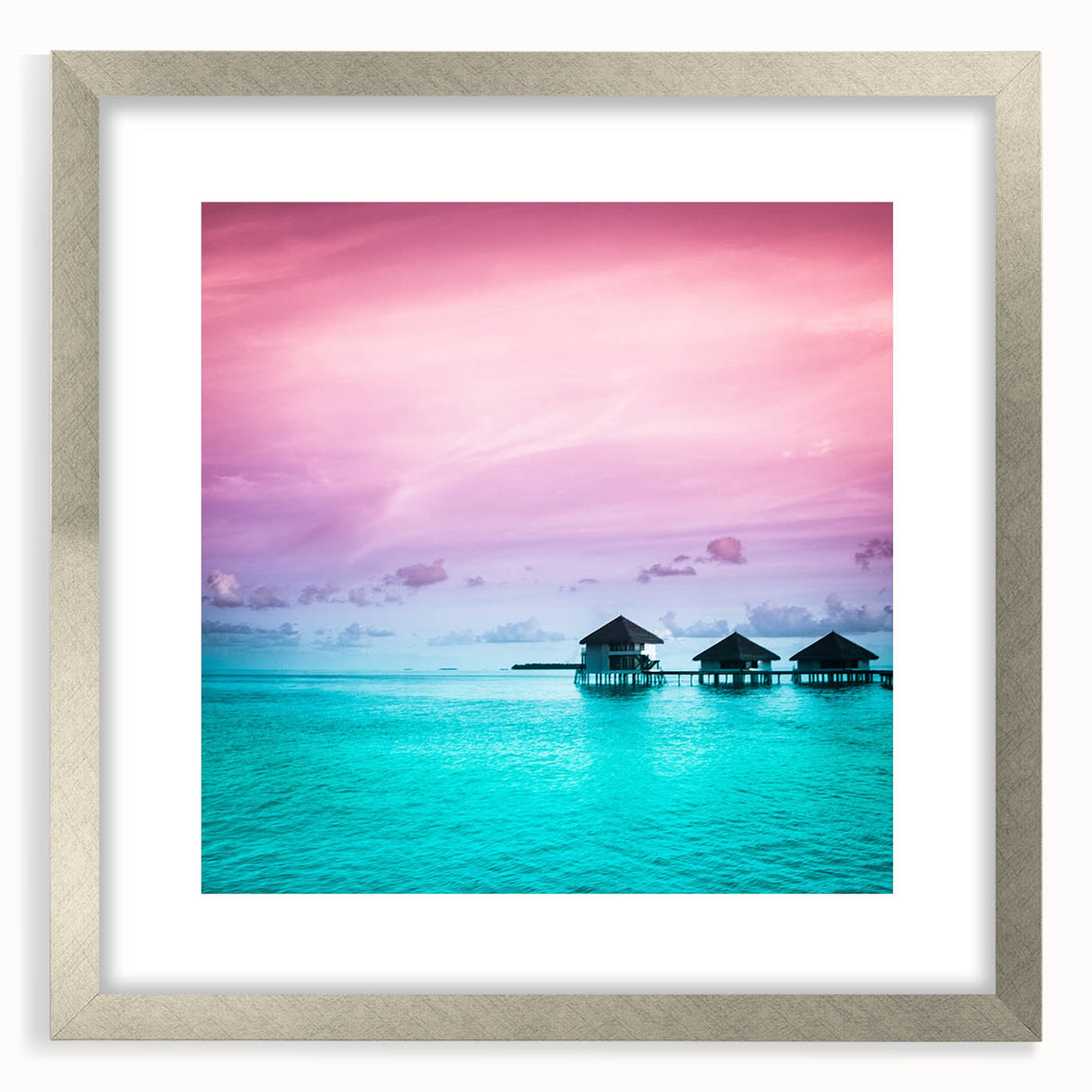 Textured abstract art print of a serene ocean scene in soft blue and gray tones, framed in silver, ideal for bedroom art.