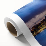 Art deco poster of Auckland skyline in muted blues and greens on rolled canvas, ideal for nursery wall art.