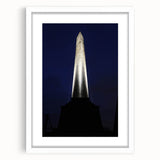 Abstract art print of Wellington skyline in muted blue and grey tones on a white framed canvas.