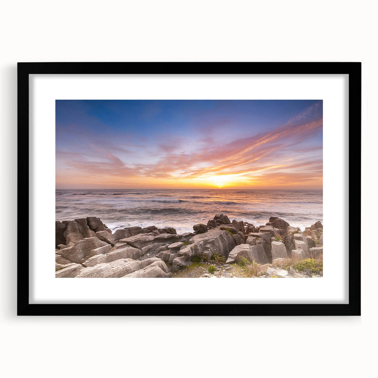 Abstract art print depicting New Zealand's West Coast in vibrant, textured colors on a large framed canvas.