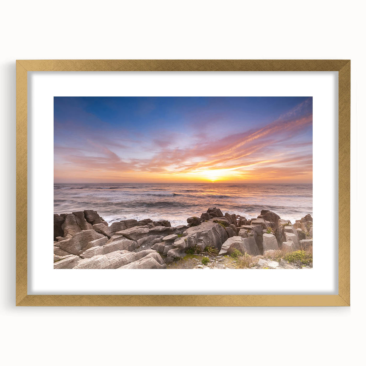 Extra large abstract art print of New Zealand's west coast in textured style, using muted earth tones, framed in gold.