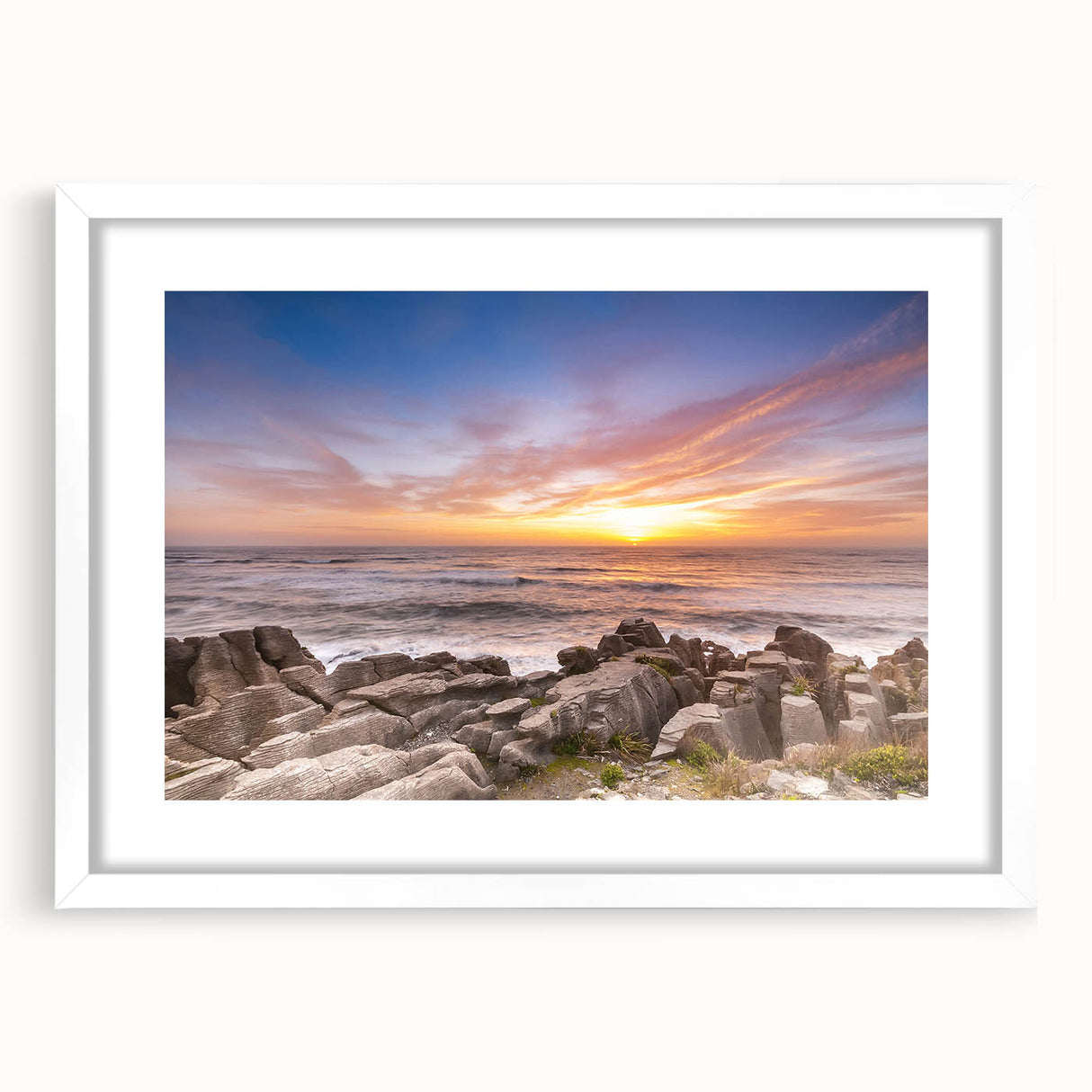 Abstract art print of New Zealand's West Coast in muted blue and gray tones on a framed white canvas.