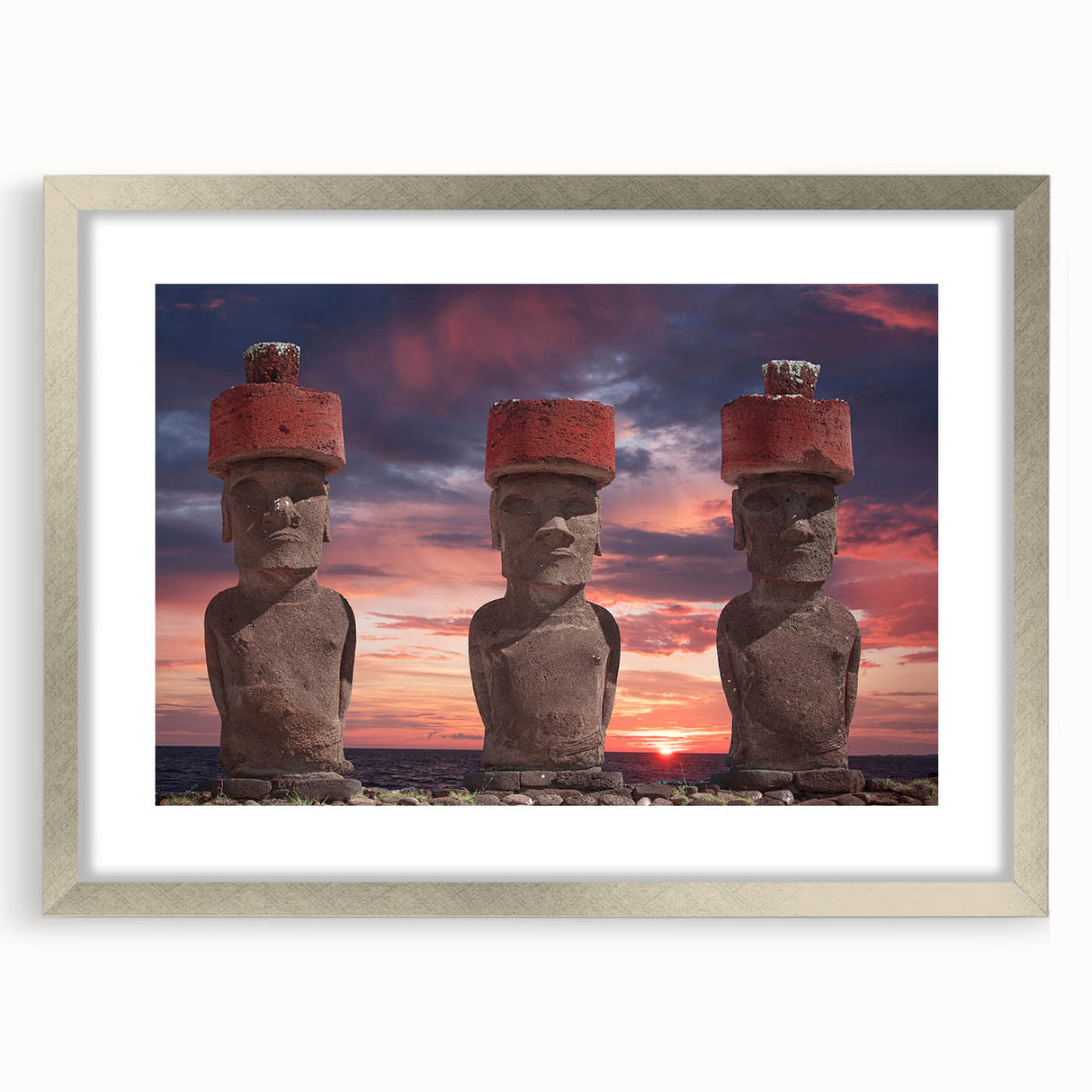 Textured art of Easter Island statues in muted earth tones on a framed canvas, suitable for bedroom decor.