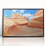 Large abstract wall art depicting Arizona's Coyote Buttes in muted earth tones on a black framed acrylic print.