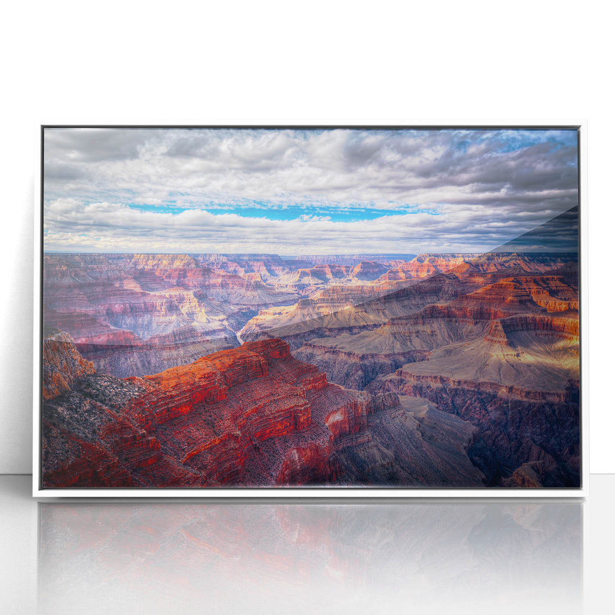 Acrylic print of the Grand Canyon in muted earth tones, framed in white, suitable for modern art wall decor.
