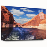 Large abstract wall art of Lake Powell on acrylic glass, featuring vivid blue and orange tones.