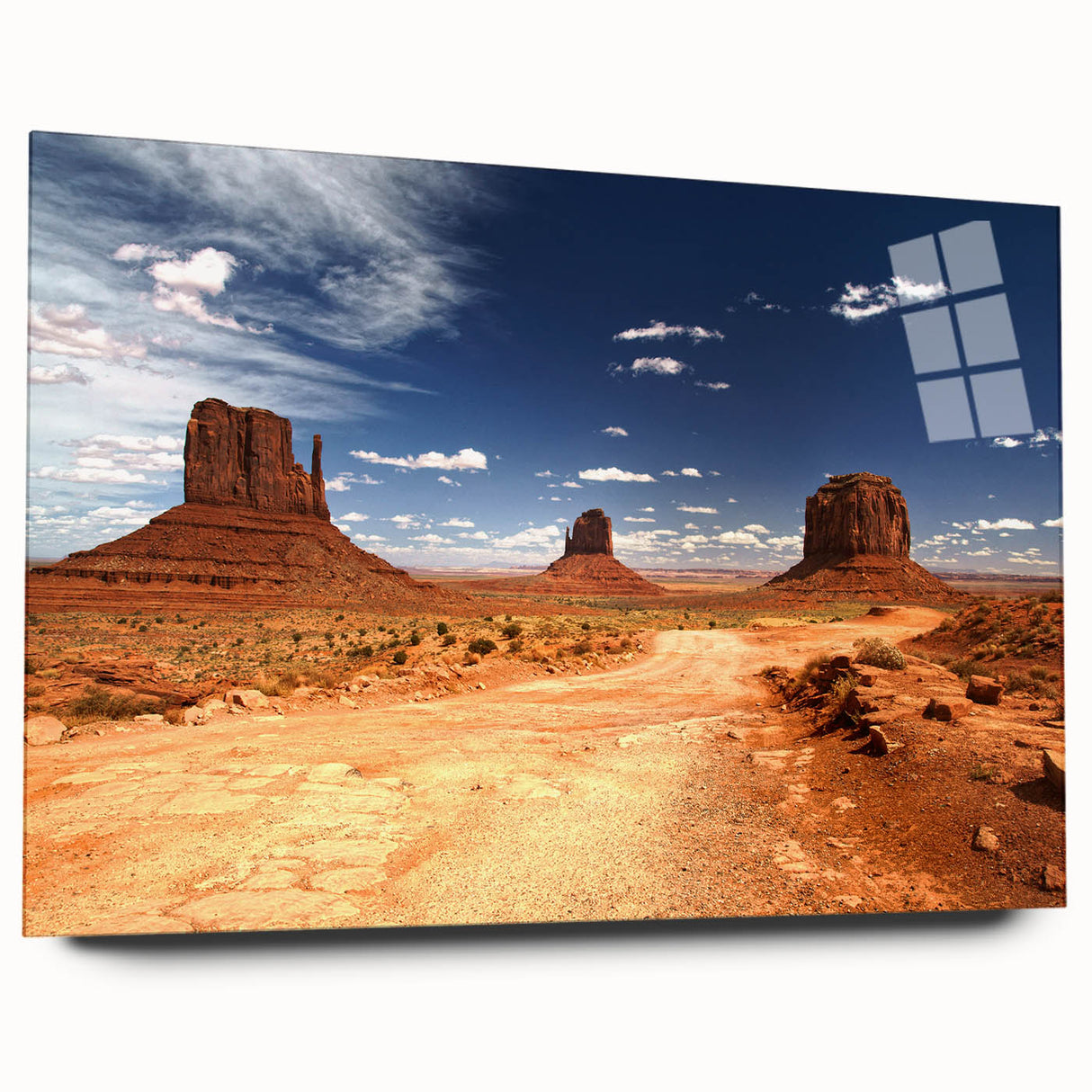 Large abstract wall art of Monument Valley on acrylic glass, featuring earthy red and orange tones.