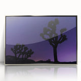 Mid-century modernist art depicting a Joshua Tree in muted earth tones on a silver-framed acrylic print.