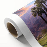 Art deco poster of Palm Springs scenery on rolled canvas, featuring pastel colors.
