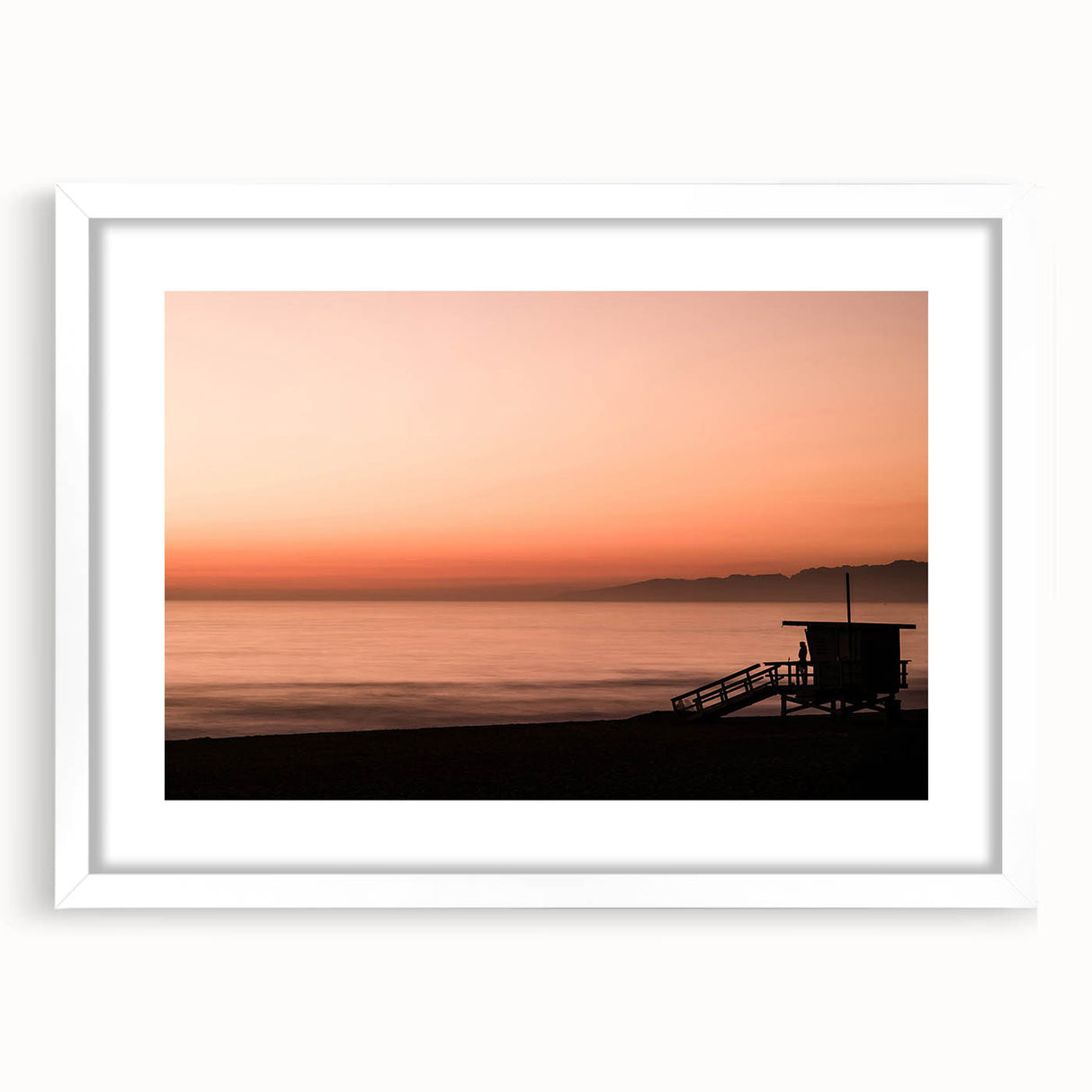 Abstract art print of Santa Monica scenery in muted blue and green tones on a framed white mat.