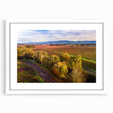 Abstract art print of Sonoma landscape in muted earth tones on white-framed canvas, ideal for dining room decor.