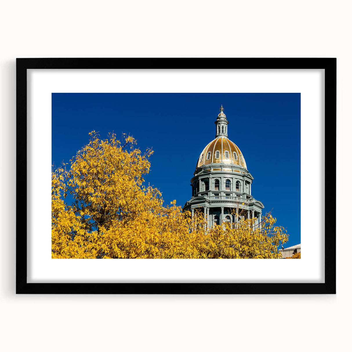 Extra large framed abstract art print of a colorful Denver skyline, ideal for living room decor.