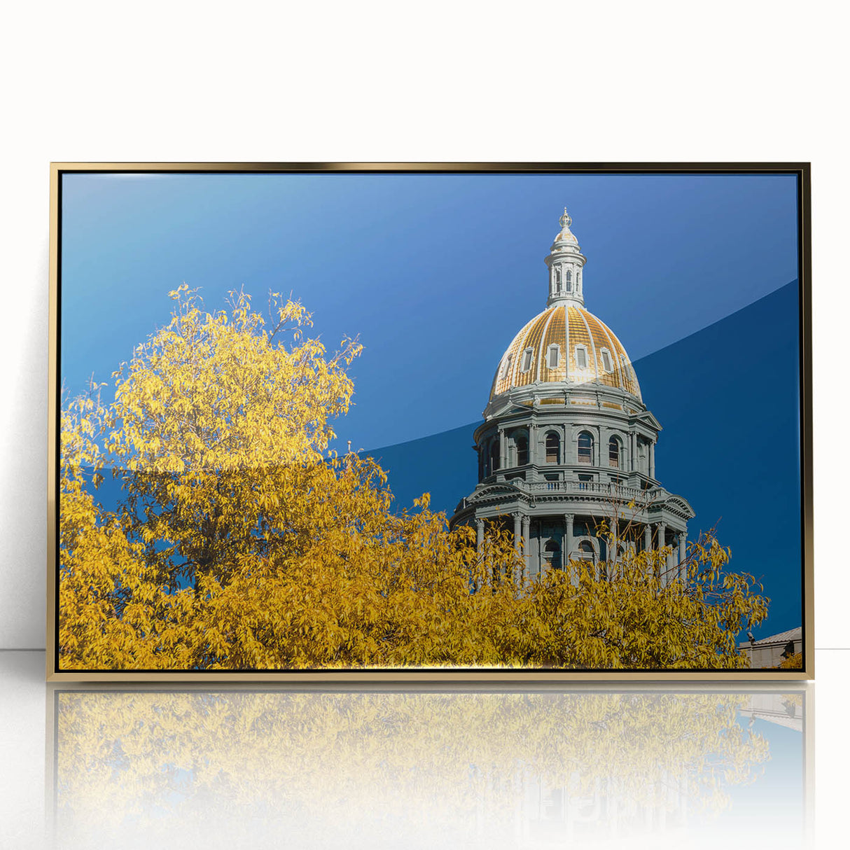 Mid-century modernist Denver skyline in gold and blue tones on a framed acrylic print, suitable for modern art wall decor.