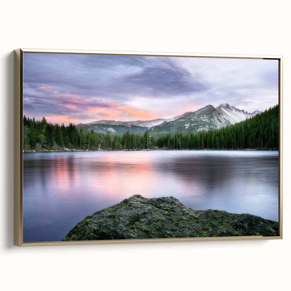 Framed canvas featuring a vintage-style landscape painting of the Rocky Mountains in muted gold and black tones.