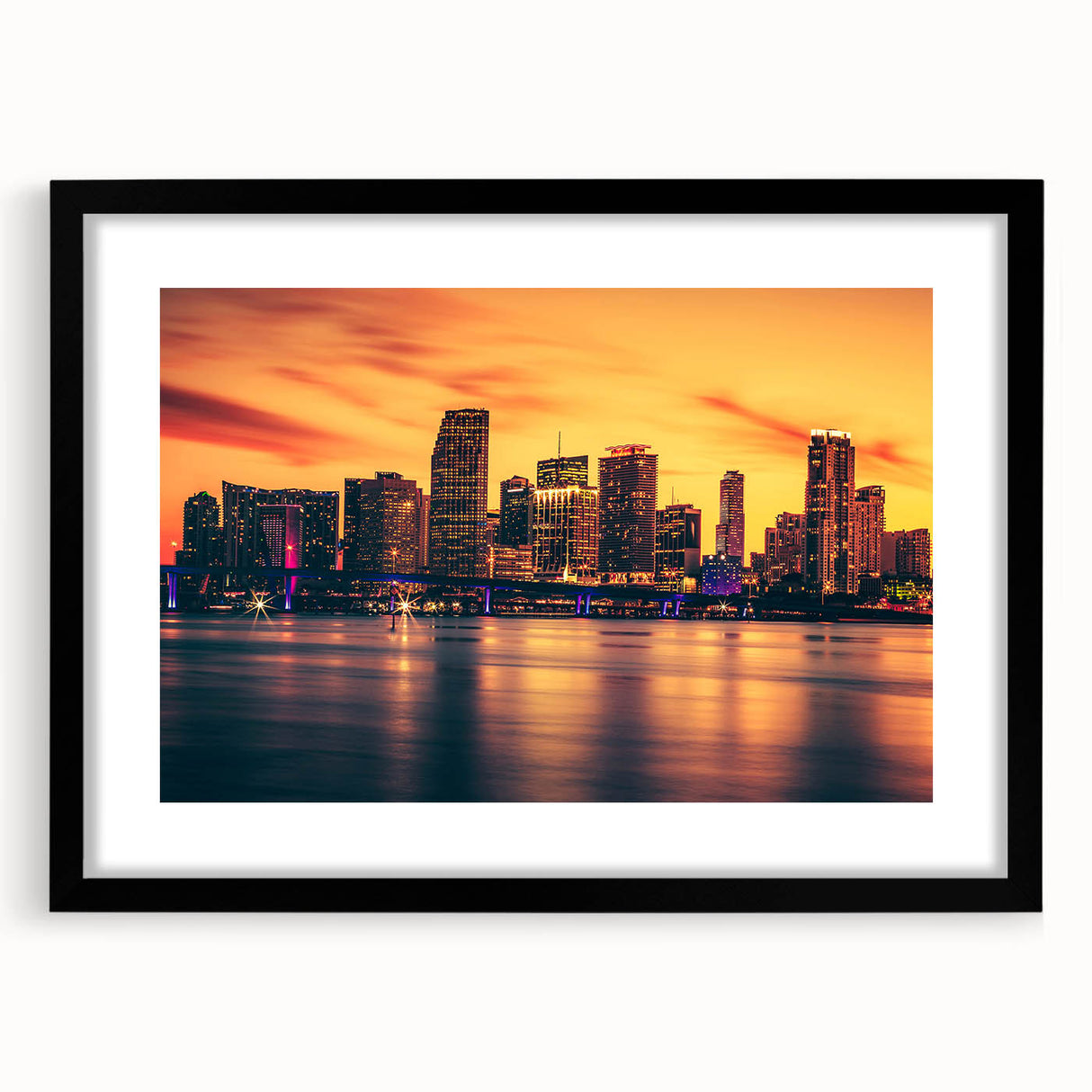 Extra large abstract art print of vibrant Miami scenery on a textured canvas, framed in black.