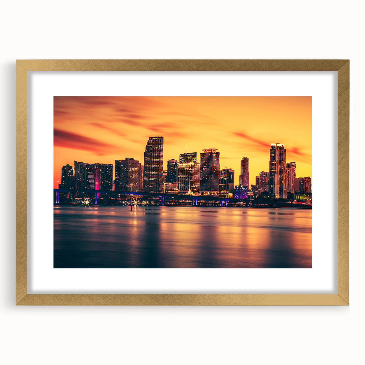 Extra large abstract art print of Miami skyline in textured gold frame, featuring vibrant colors.