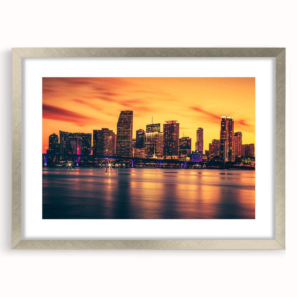 Textured abstract art print depicting a vibrant Miami skyline, in a silver frame, ideal for bedroom wall decor.
