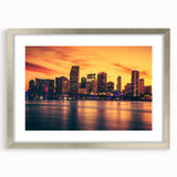 Textured abstract art print depicting a vibrant Miami skyline, in a silver frame, ideal for bedroom wall decor.
