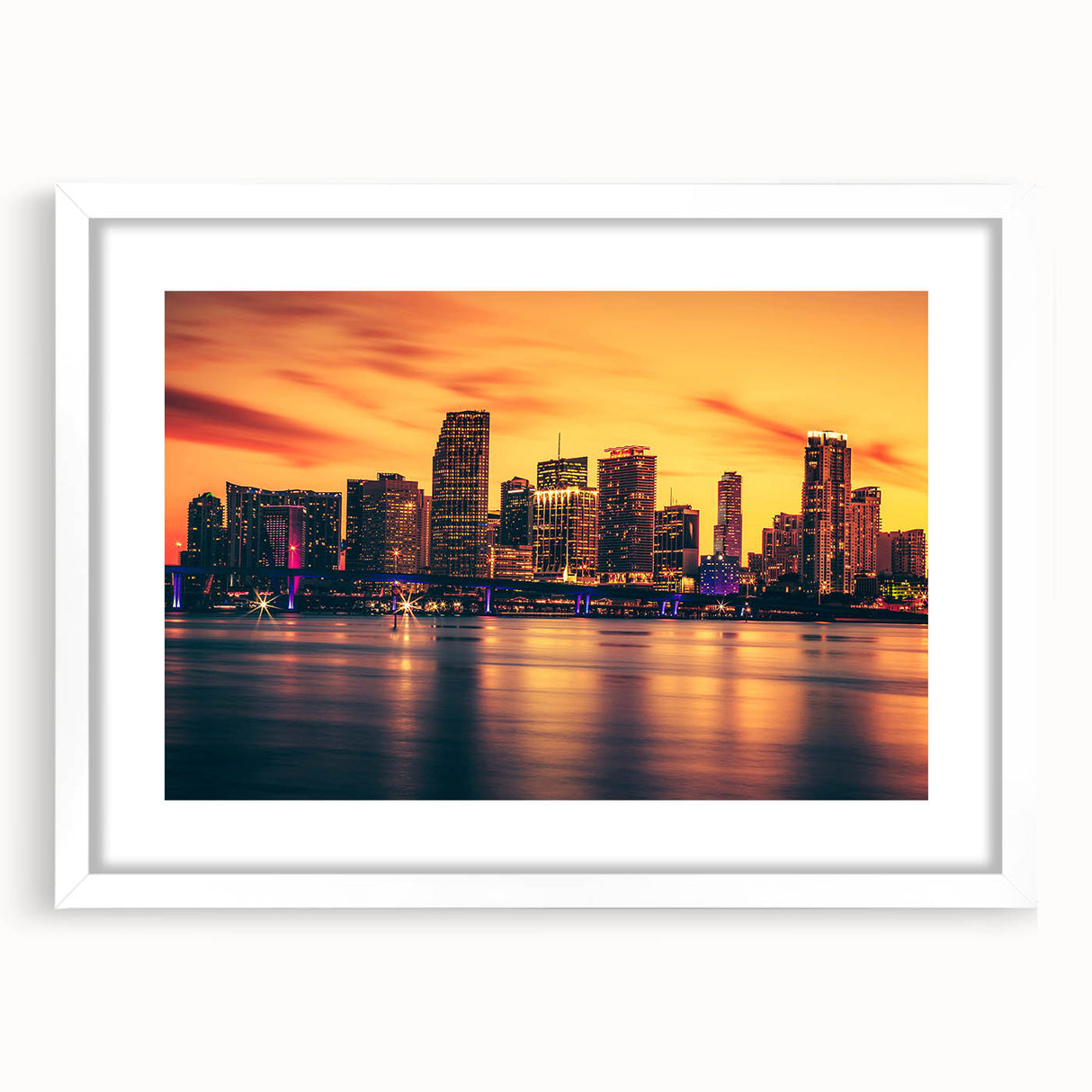 Abstract art print of the Miami skyline in pastel shades on a framed white mat, ideal for bedroom or dining room decor.
