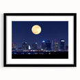 Abstract art print of Tampa scenery in colorful, textured strokes on a large black-framed canvas.