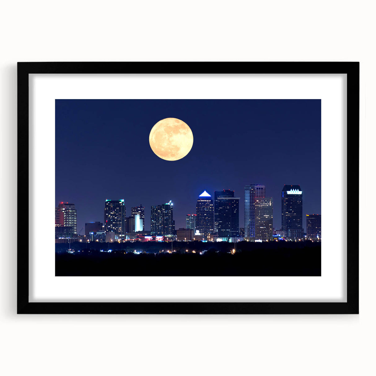 Abstract art print of Tampa scenery in colorful, textured strokes on a large black-framed canvas.