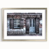 Textured abstract art print of New Orleans in muted earth tones on a framed silver mat, ideal for bedroom art.