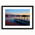 Abstract art print depicting textured colorful Maine scenery, in a black frame with mat, ideal for living room decor.