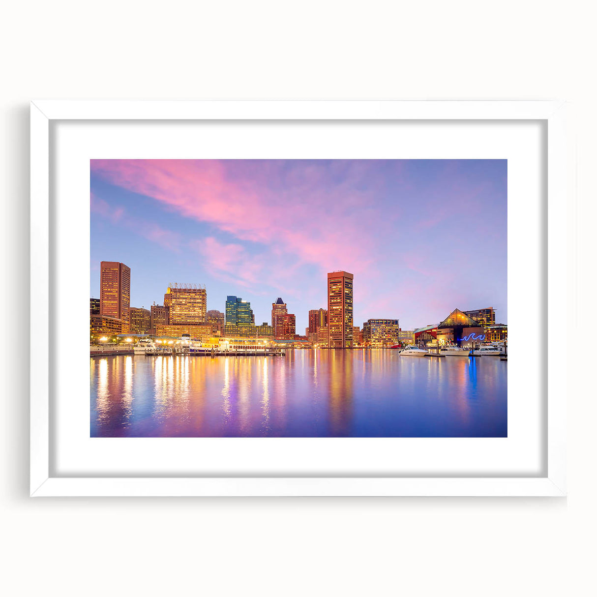 Abstract art print of Baltimore skyline in muted blue and gray tones on a framed white mat, ideal for dining room decor.