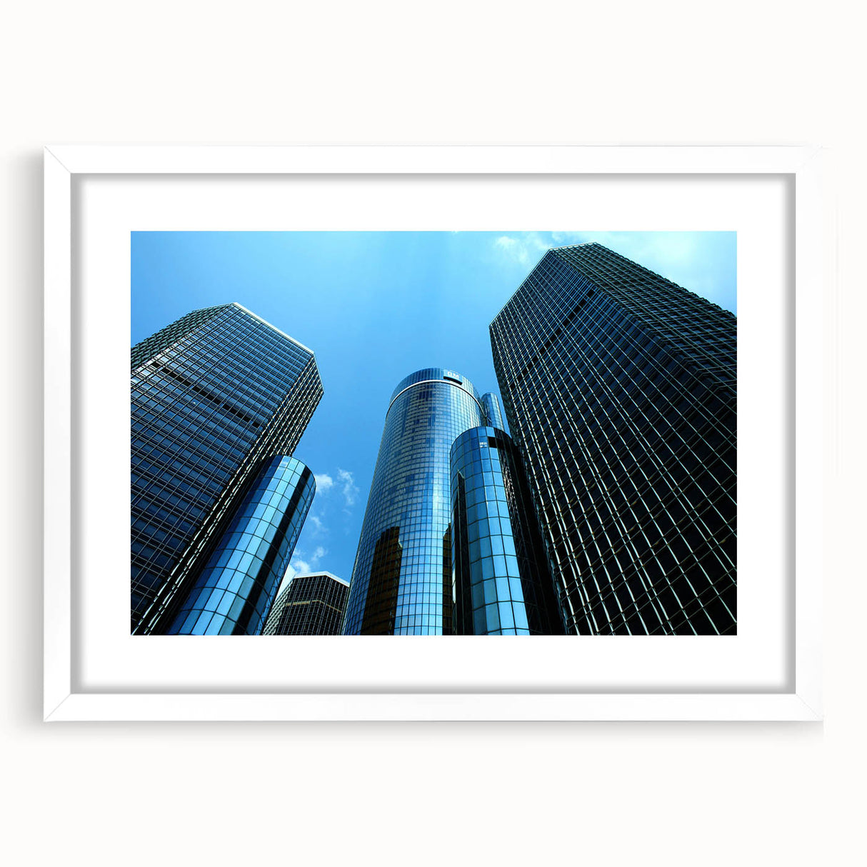 Abstract art print of Detroit skyline in muted gray and blue tones on a framed white mat, suitable for dining room decor.
