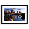 Abstract art print of Minneapolis skyline in vibrant colors on a large, textured canvas, ideal for living room decor.