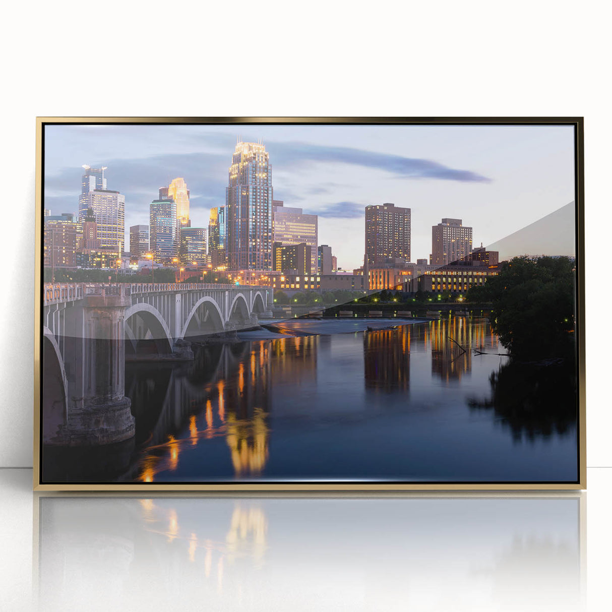Large acrylic print of Minneapolis skyline in gold hues, framed, mid-century modernist style.