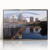 Large acrylic print of Minneapolis skyline in gold hues, framed, mid-century modernist style.