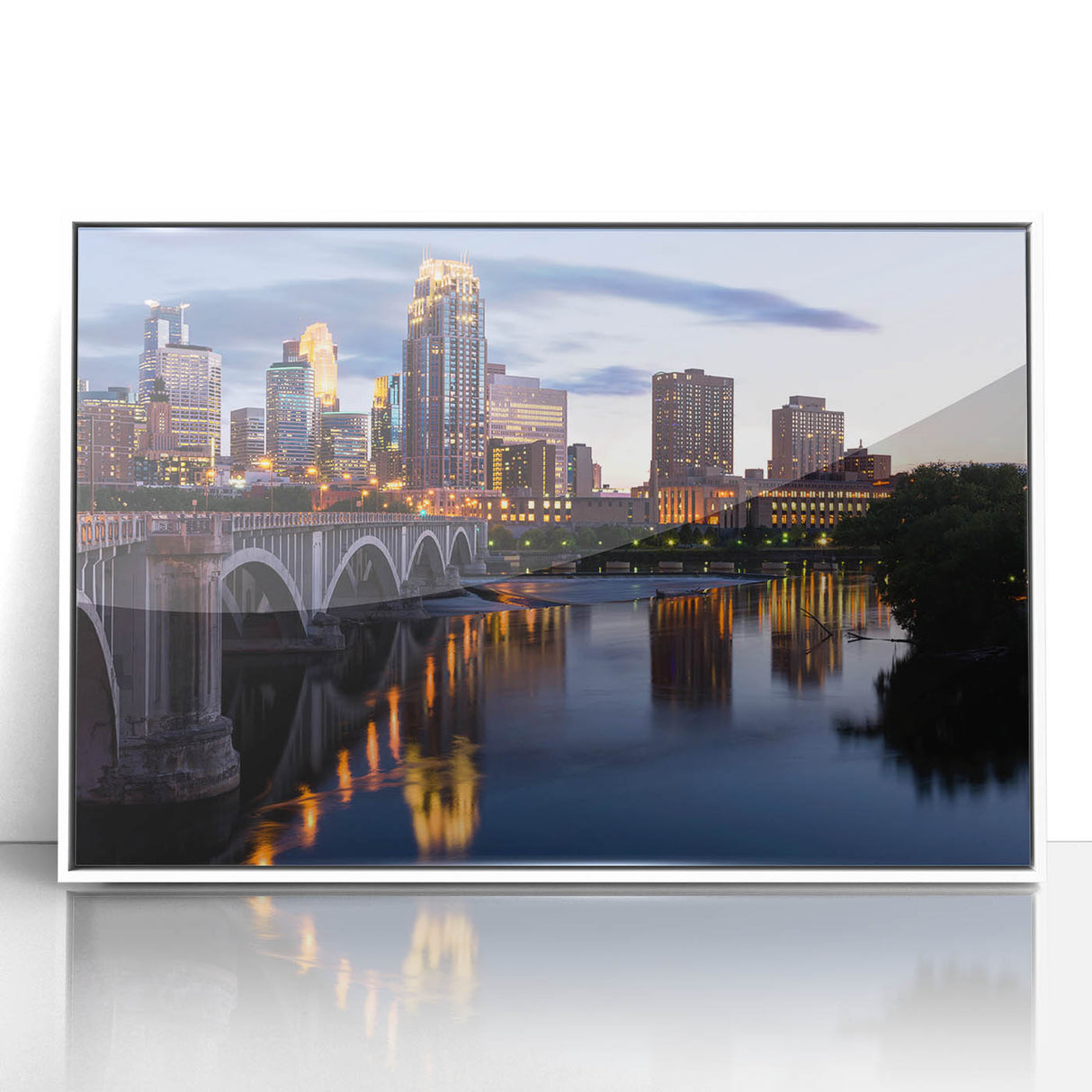 Framed acrylic print of Minneapolis skyline in art deco style with muted blue and gray tones.
