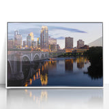 Framed acrylic print of Minneapolis skyline in art deco style with muted blue and gray tones.