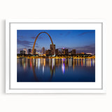 Abstract art print of St. Louis skyline in muted gray and blue tones on a white framed poster, ideal for dining room decor.