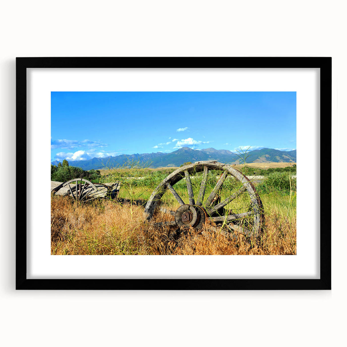 Abstract art print of Montana scenery in vibrant colors on a textured, extra large canvas, framed in black.